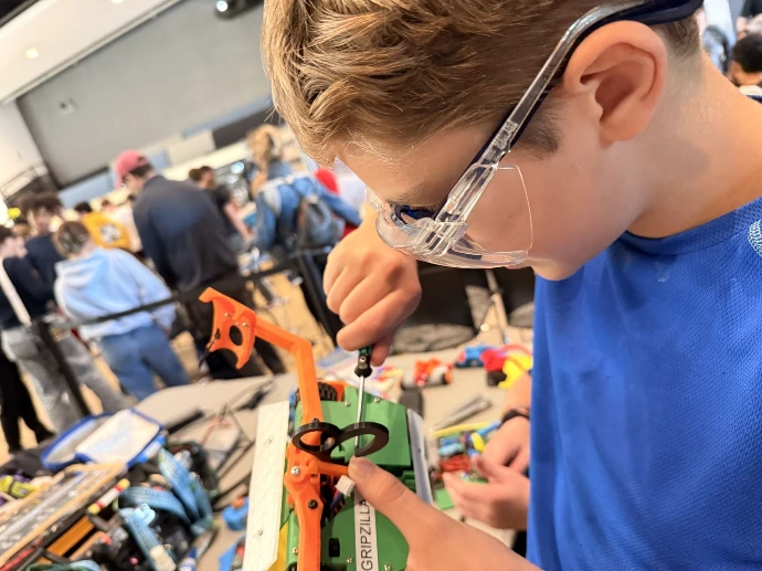 Kid working on a Turnabot combat robot